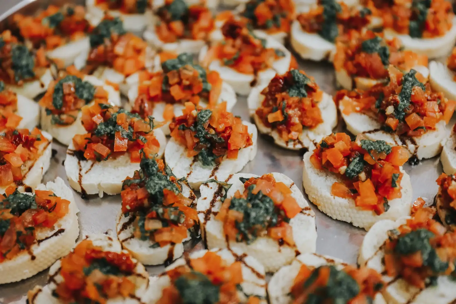 Bruschetta with tomatoes and balsamic glazed over the top showing how to meet dietary requirment of your guests at your next event.