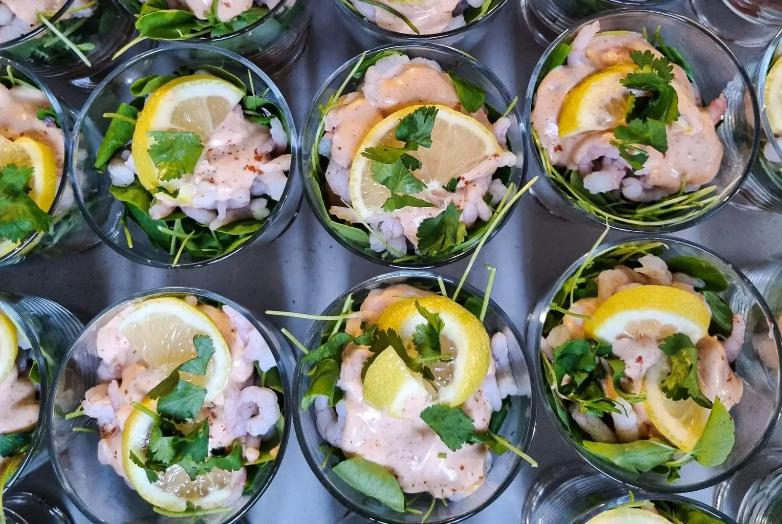 Prawn Cocktail with lemon and parsley toppings bringing success to network events with modern catering.