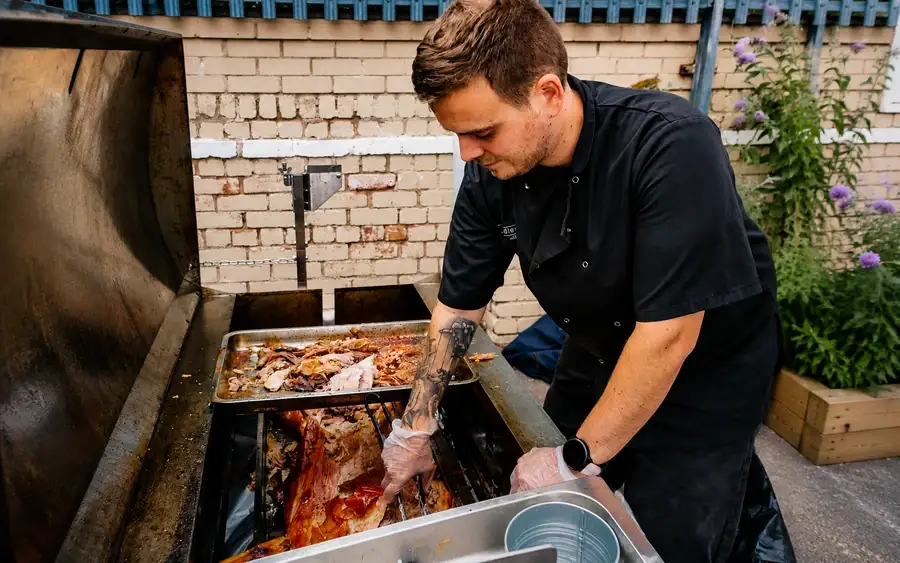 Plated hog roast with crackling, stuffing and apple sauce