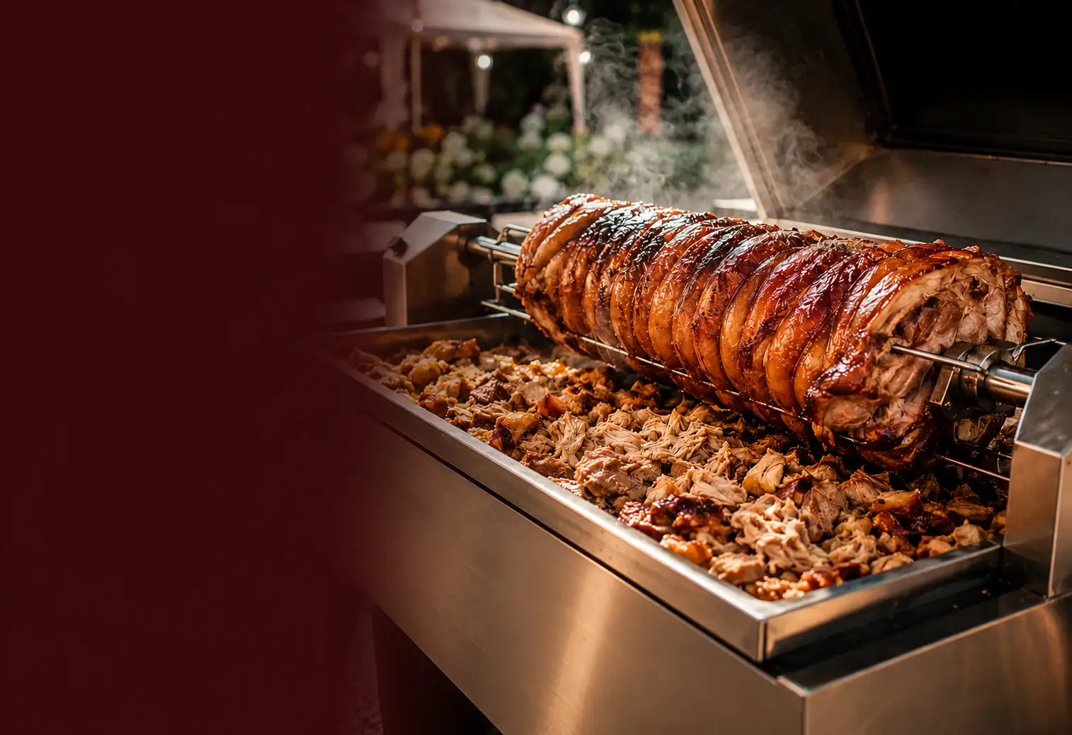 Whole hog slow-roasting on a spit with crisp golden crackling