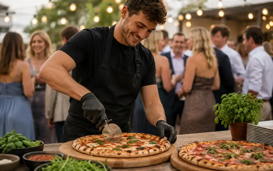 Trays of hot pizza slices set out on a serving table at an event