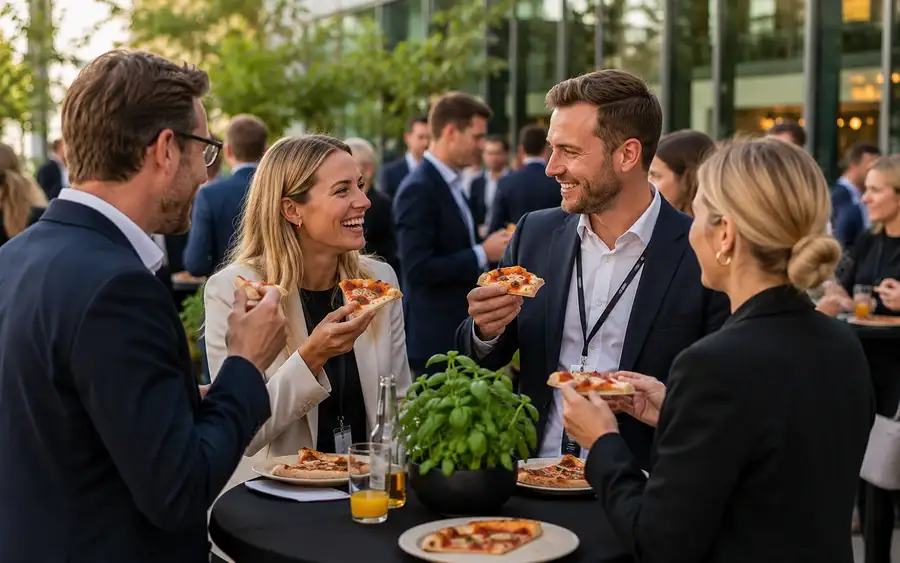 Guests queueing at the mobile pizza oven at an outdoor party