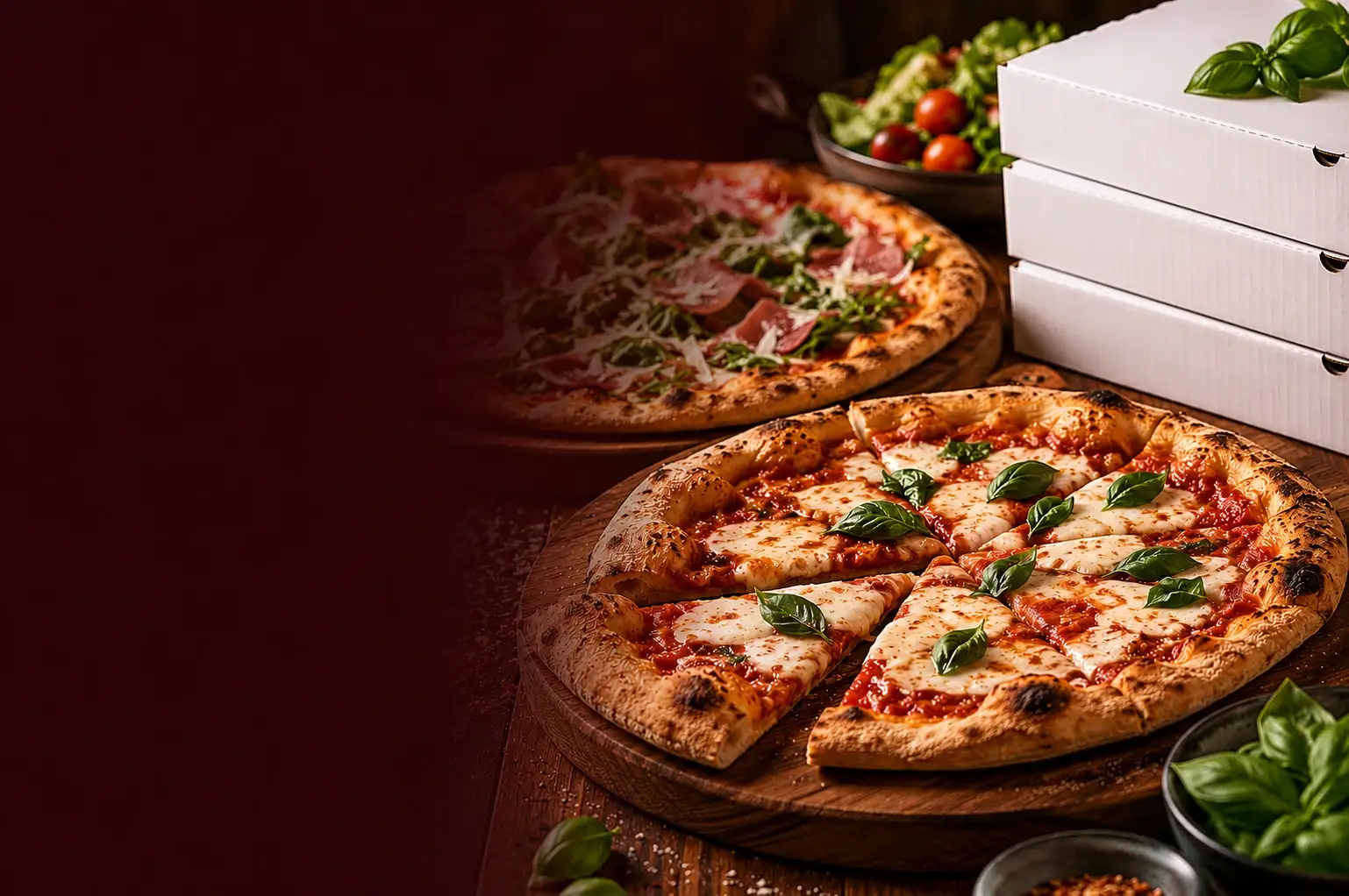 Freshly baked pizza being lifted from a mobile gas-fired oven on a wooden peel