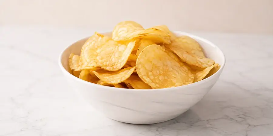 Bowl of thick-cut hand cooked crisps