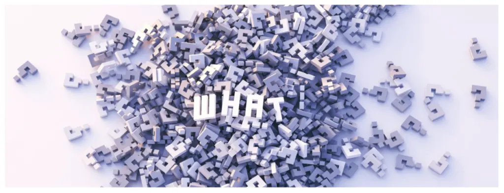 A scattered heap of three-dimensional letters with the word WHAT and a question mark picked out at the centre